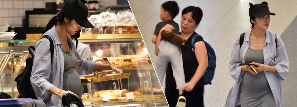 姚晨素颜带儿子现身机场 孕肚抢镜