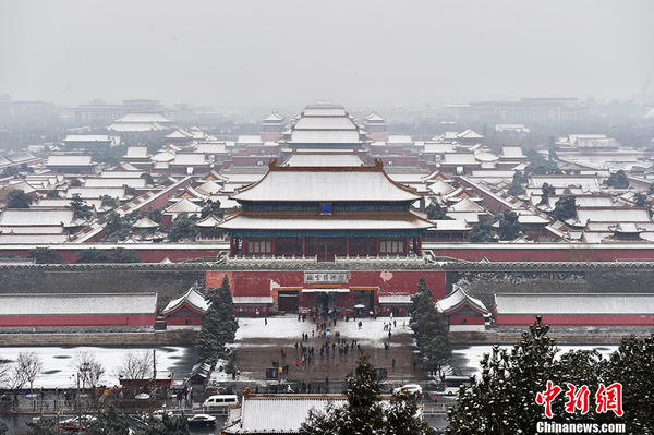图为雪中的故宫博物院。中新网记者 金硕 摄